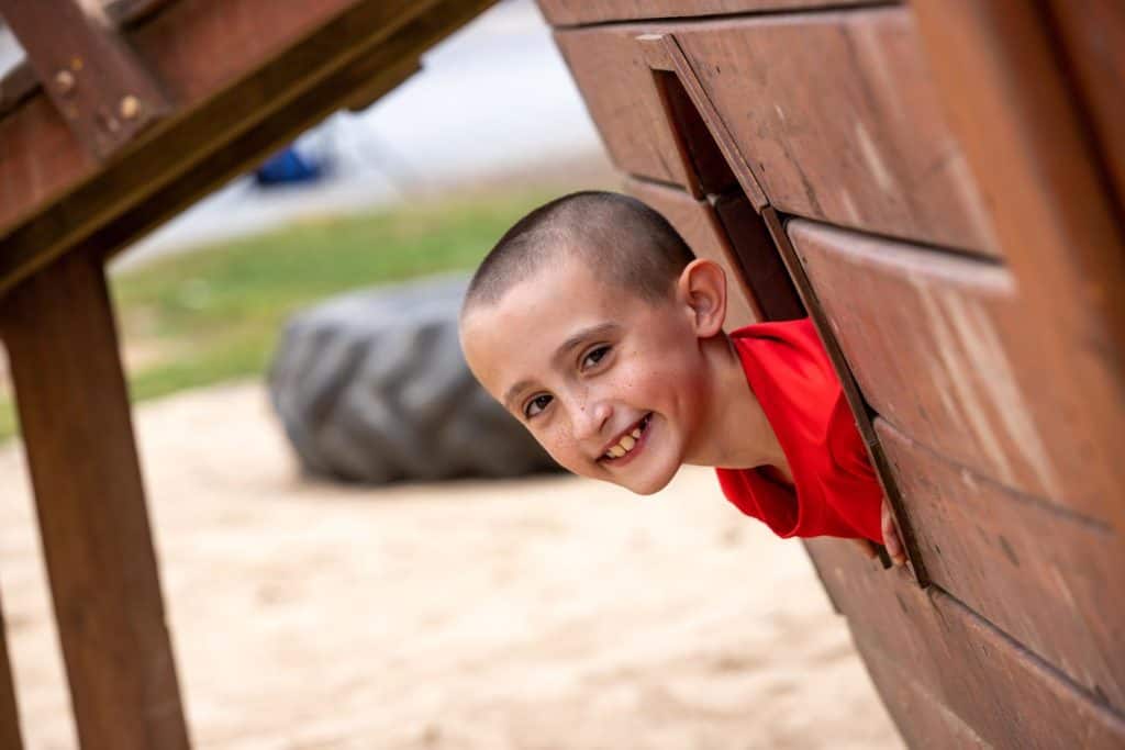 Little boy smiling on the playground