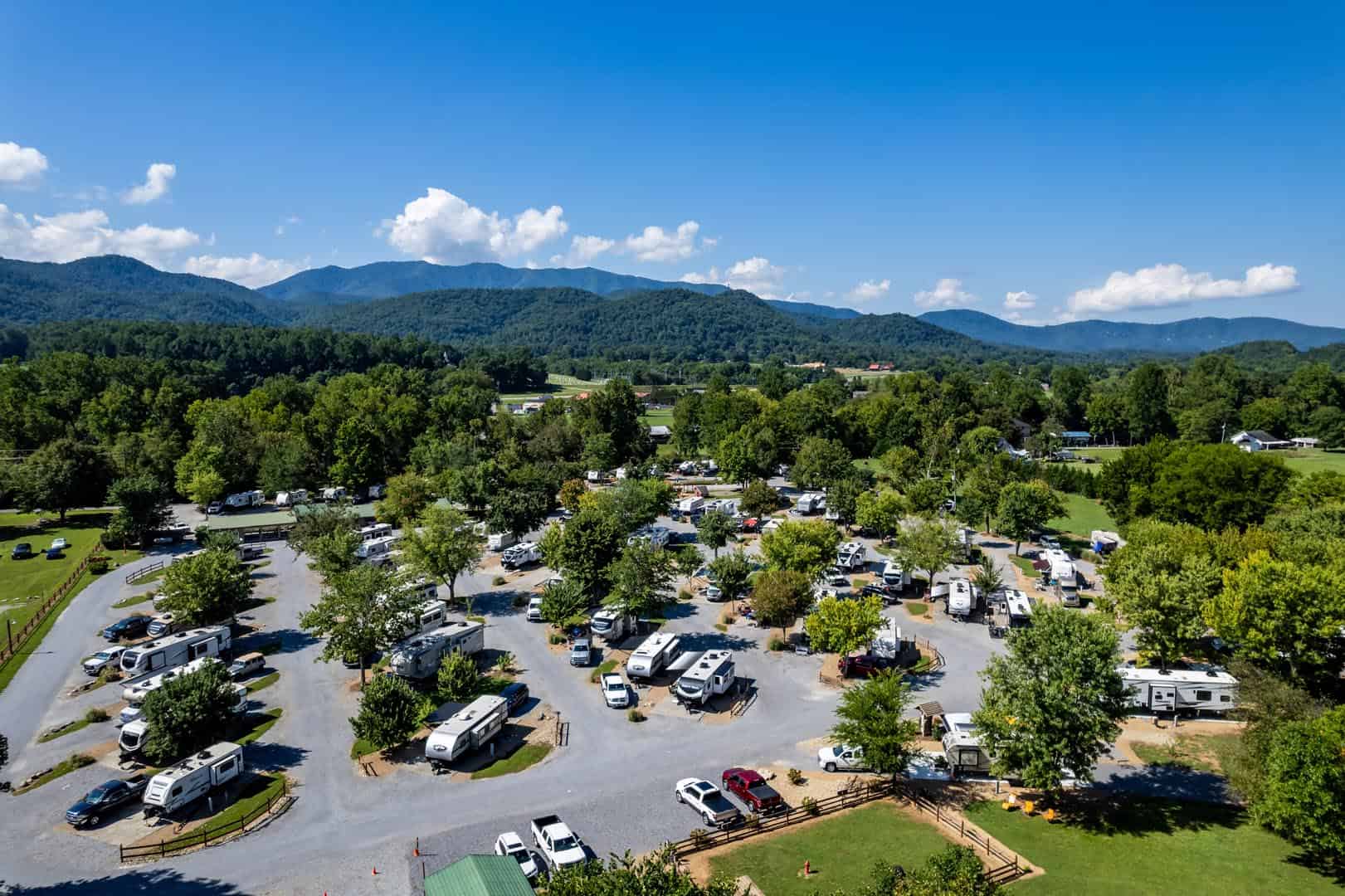 An aerial view of an rv park in the mountains.
