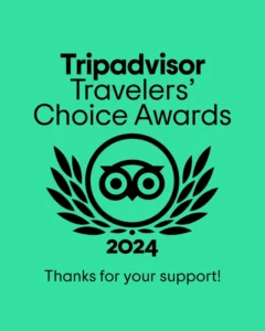 Graphic of the TripAdvisor Travelers' Choice Awards 2024, featuring an owl logo encircled by laurels on a green background, with text thanking for support at Townsend Campground.