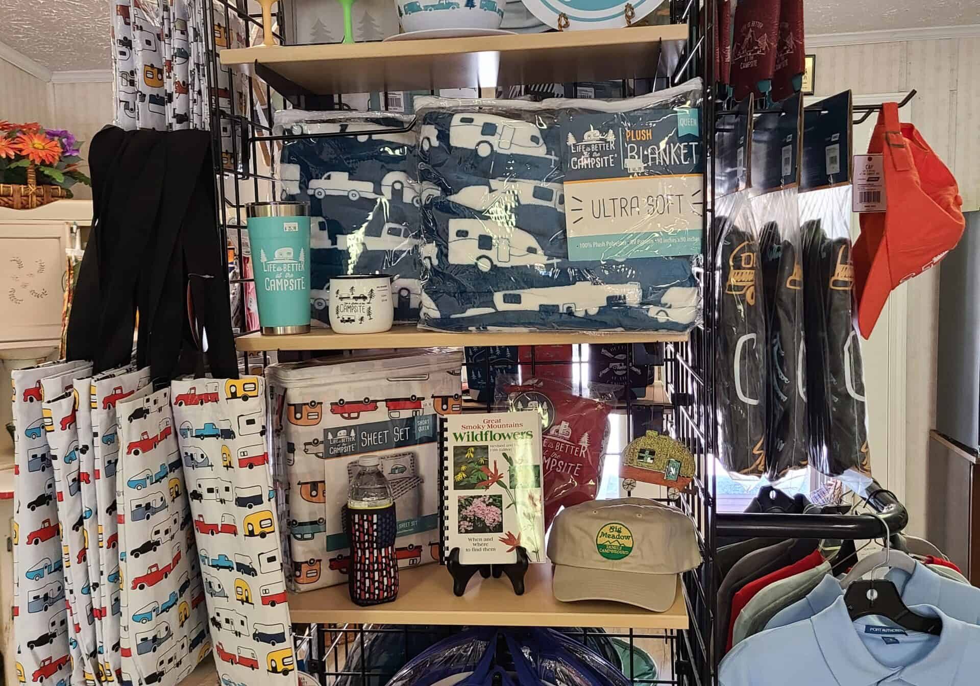 A display of shirts, hats, and other items in a store.